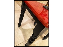 Restyled modern table in glossy red and matte black.