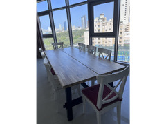 Table with 8 chairs plus cushions - like new - 2