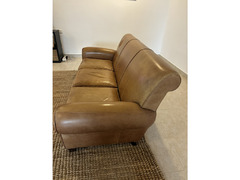 Brown leather sofa and footstool